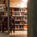 A person sitting in a library with books