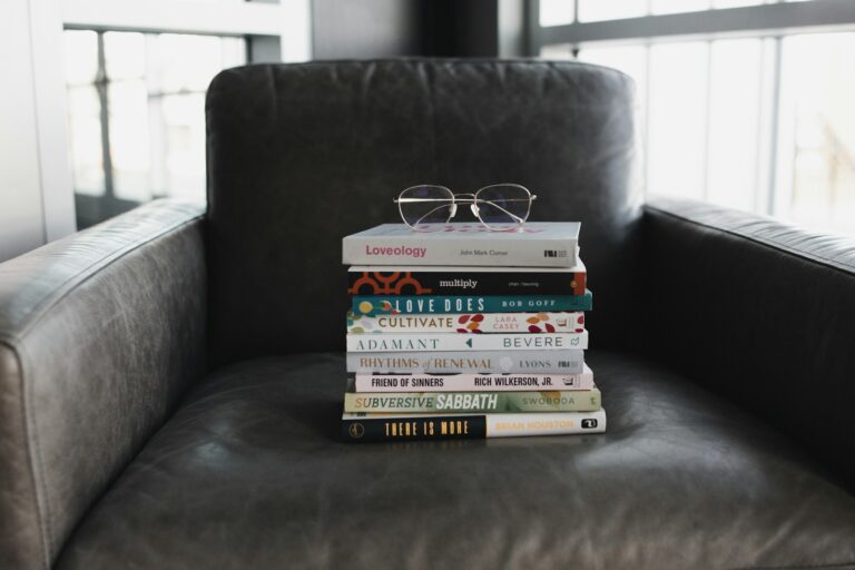 assorted books on black couch