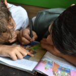 boy's writing on book